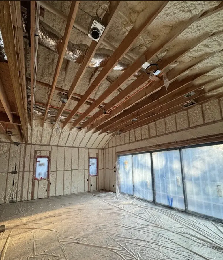 Interior walls and ceiling insulated with spray foam during new construction in Madisonville
